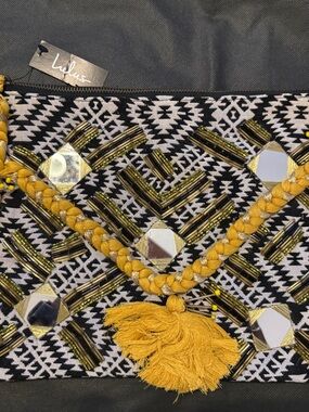 Lulu's Black & White Geometric Clutch with Mustard Tassel Trim